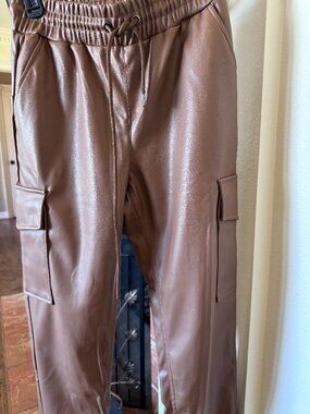 Brown leather-like joggers from Saks